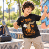 Child wearing black Feel the Music dog kids t-shirt featuring a cartoon dog with sunglasses and headphones by Charm and Chic.